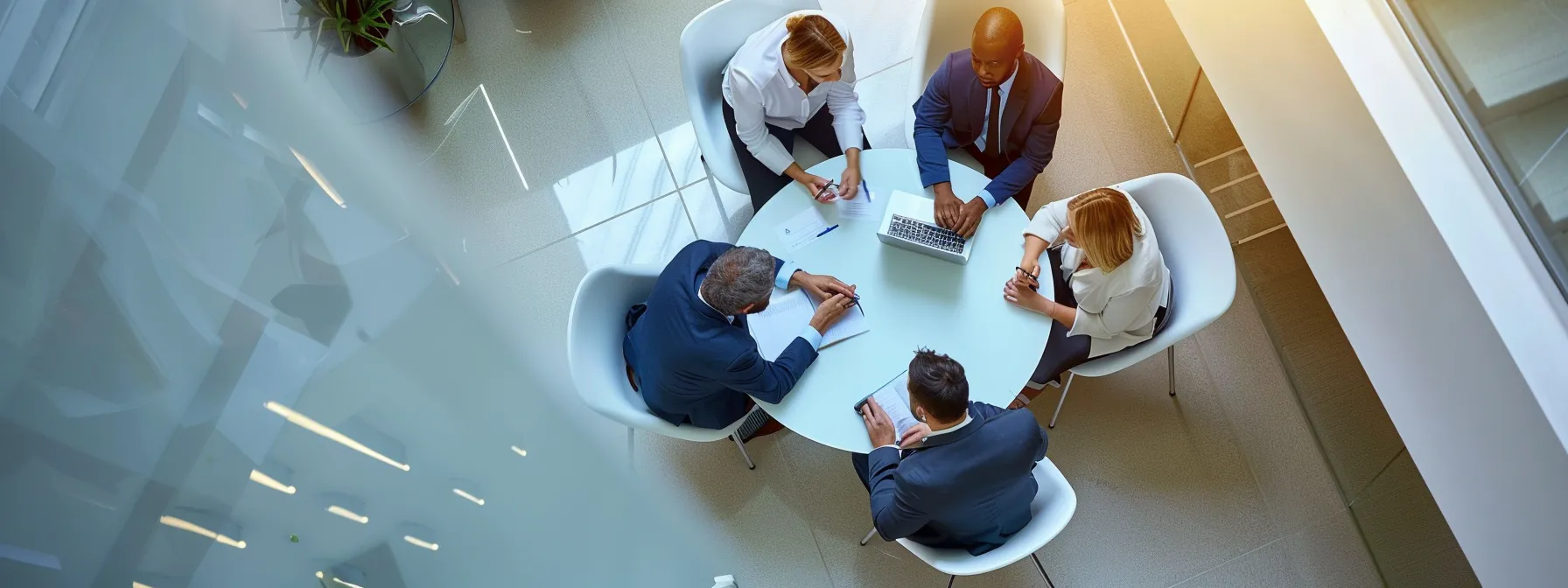 a group of business professionals engages in a focused discussion about roof replacement strategies.